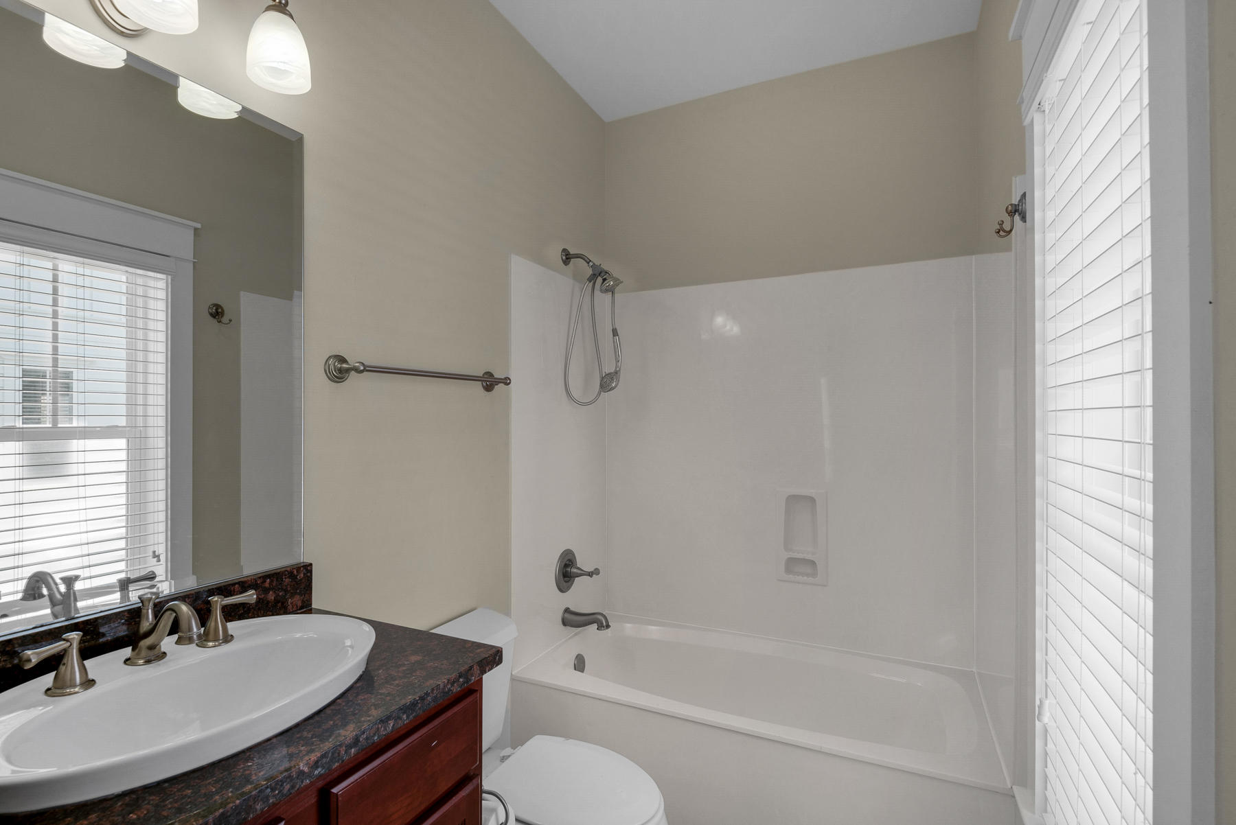 7 Seaspring Cove Santa Rosa Beach, FL 32459 - Photo 30 of 46 a bathroom with a bathtub a sink a mirror a vanity and a shower