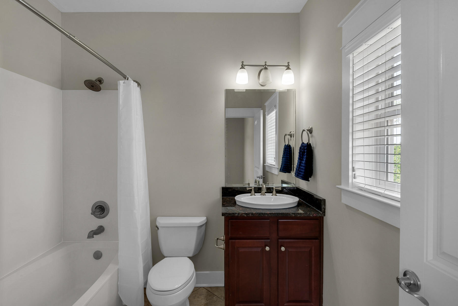 7 Seaspring Cove Santa Rosa Beach, FL 32459 - Photo 44 of 46 a bathroom with a sink a toilet a mirror and shower