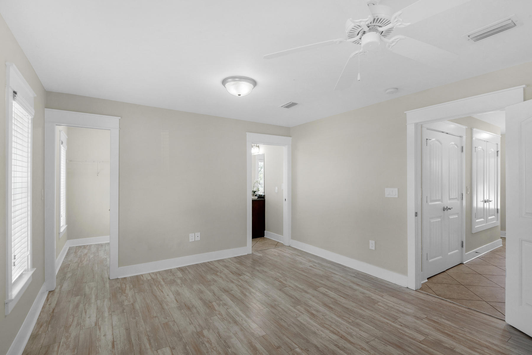 7 Seaspring Cove Santa Rosa Beach, FL 32459 - Photo 10 of 46 wooden floor in an empty room with a window