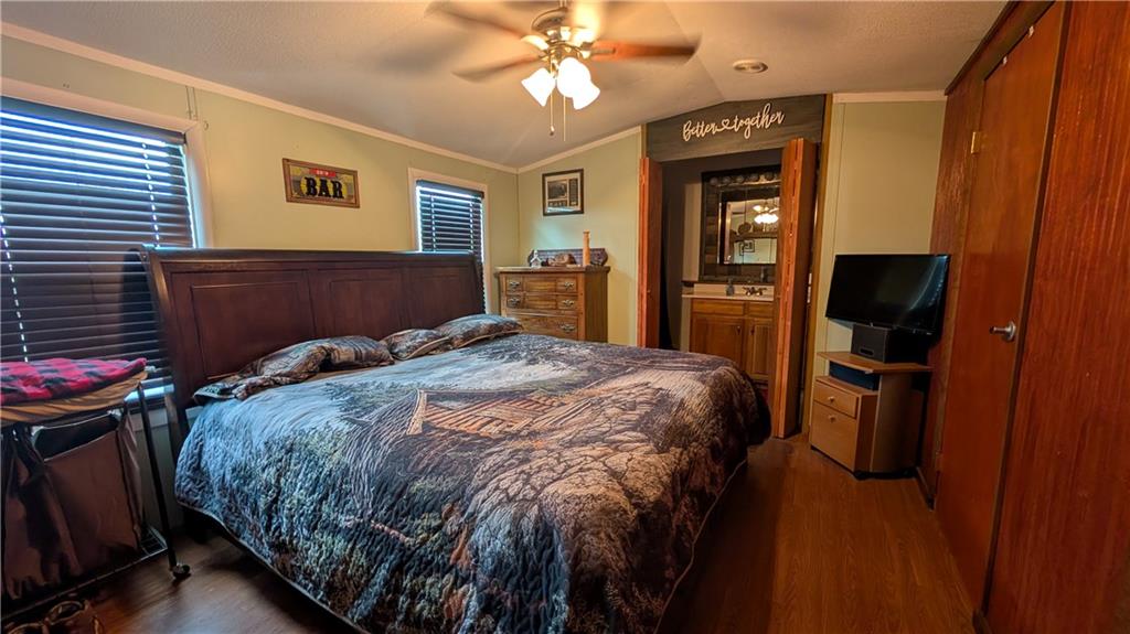 203 Colvin Road Greensboro, PA 15338 - Photo 7 of 20 a bedroom with a bed and a chandelier