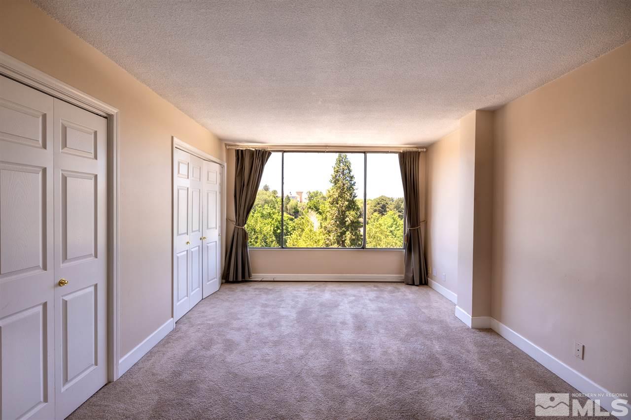 280 Island, Unit 703 Reno, NV 89501 - Photo 15 of 34 an empty room with large windows and a yard