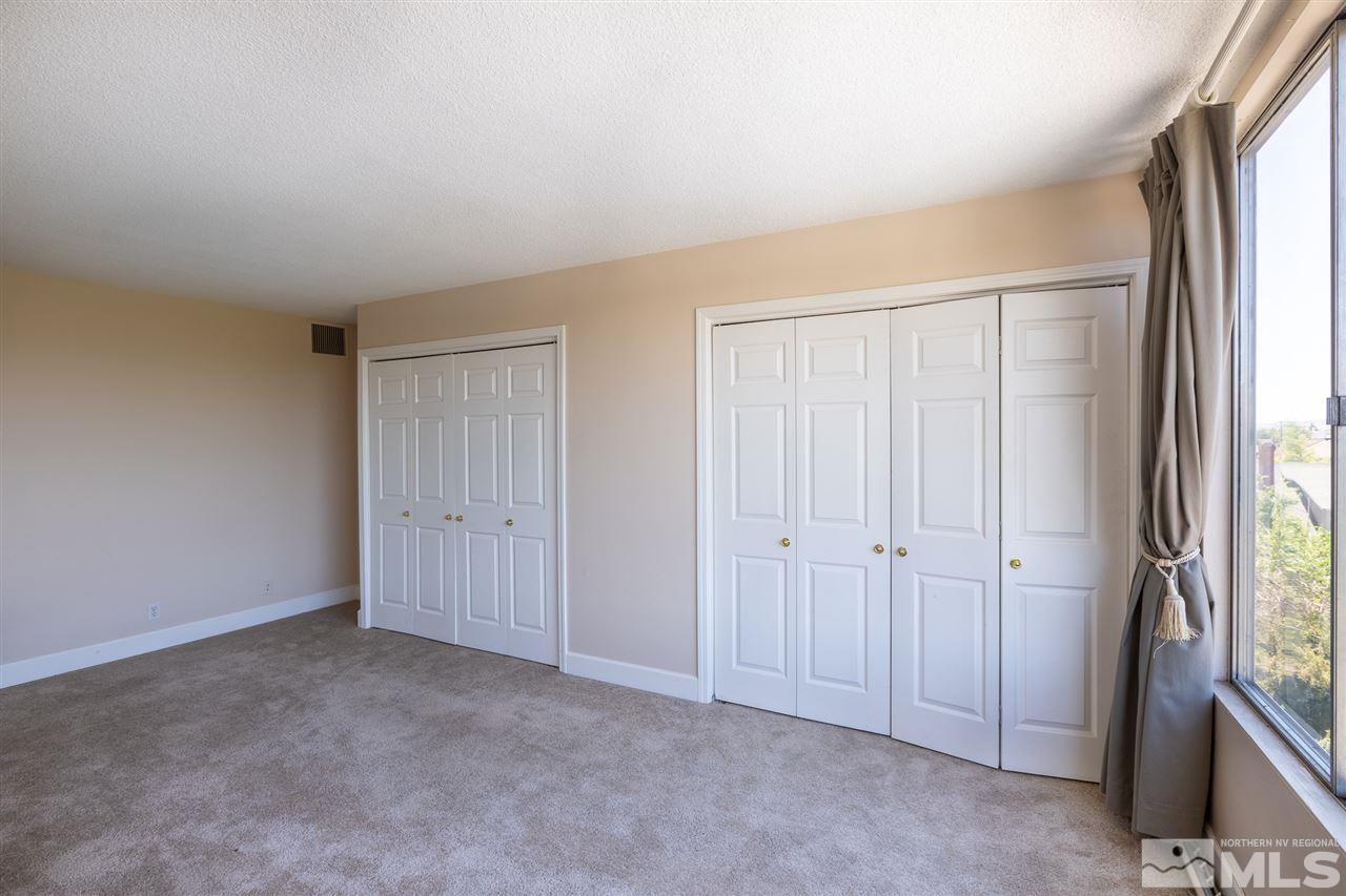 280 Island, Unit 703 Reno, NV 89501 - Photo 18 of 34 an empty room with windows and closet