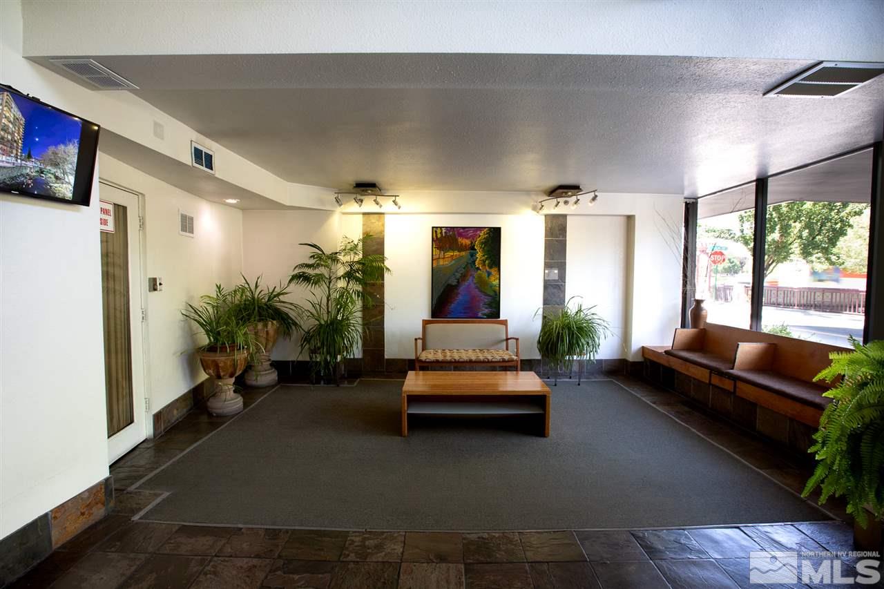 280 Island, Unit 703 Reno, NV 89501 - Photo 27 of 34 a living room with furniture and a potted plant