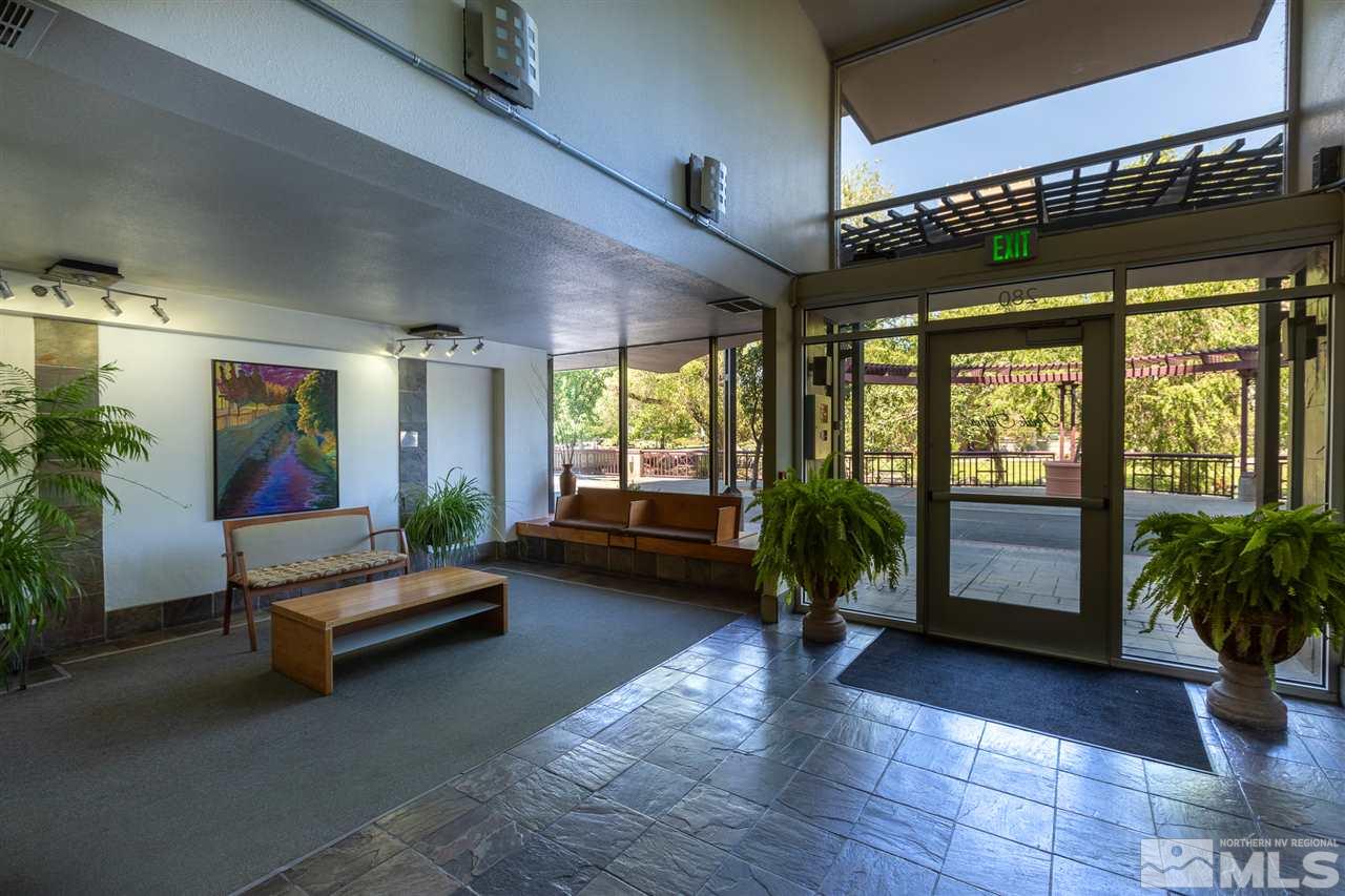 280 Island, Unit 703 Reno, NV 89501 - Photo 28 of 34 a lobby with furniture and floor to ceiling window