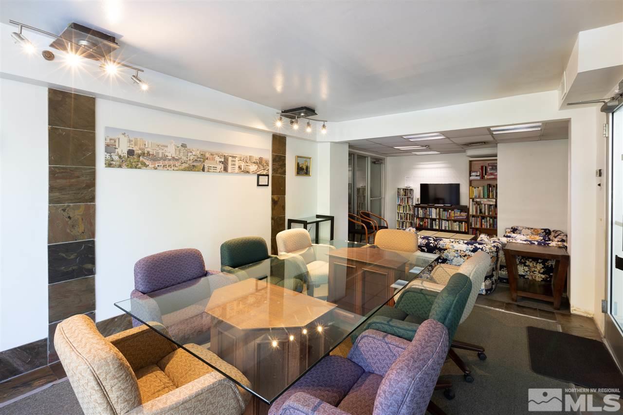 280 Island, Unit 703 Reno, NV 89501 - Photo 29 of 34 a living room with furniture kitchen view and a chandelier