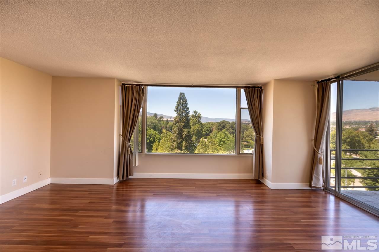 280 Island, Unit 703 Reno, NV 89501 - Photo 8 of 34 a view of empty room with wooden floor and fan
