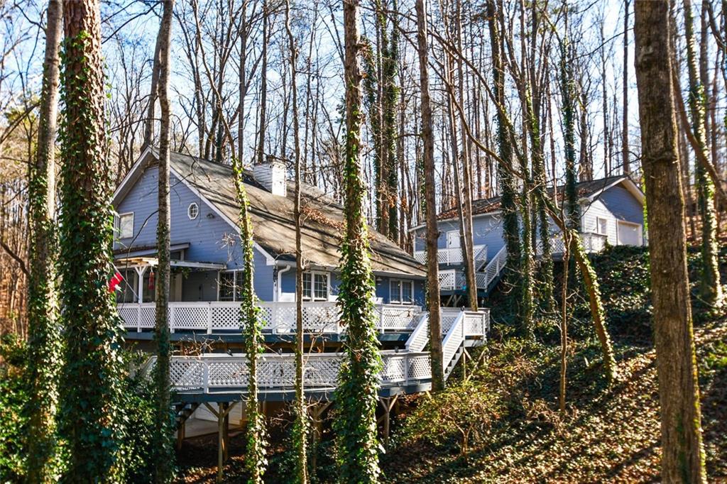 front view of a house with a tree