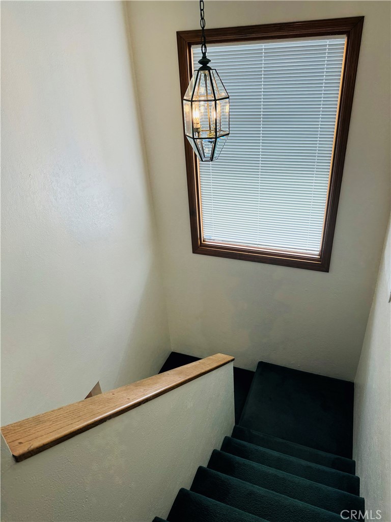 87 Rivo Alto Canal Long Beach, CA 90803 - Photo 18 of 34 a view of staircase with wooden floor and potted plant