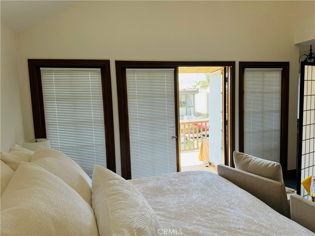87 Rivo Alto Canal Long Beach, CA 90803 - Photo 24 of 34 a bedroom with a bed and a large window