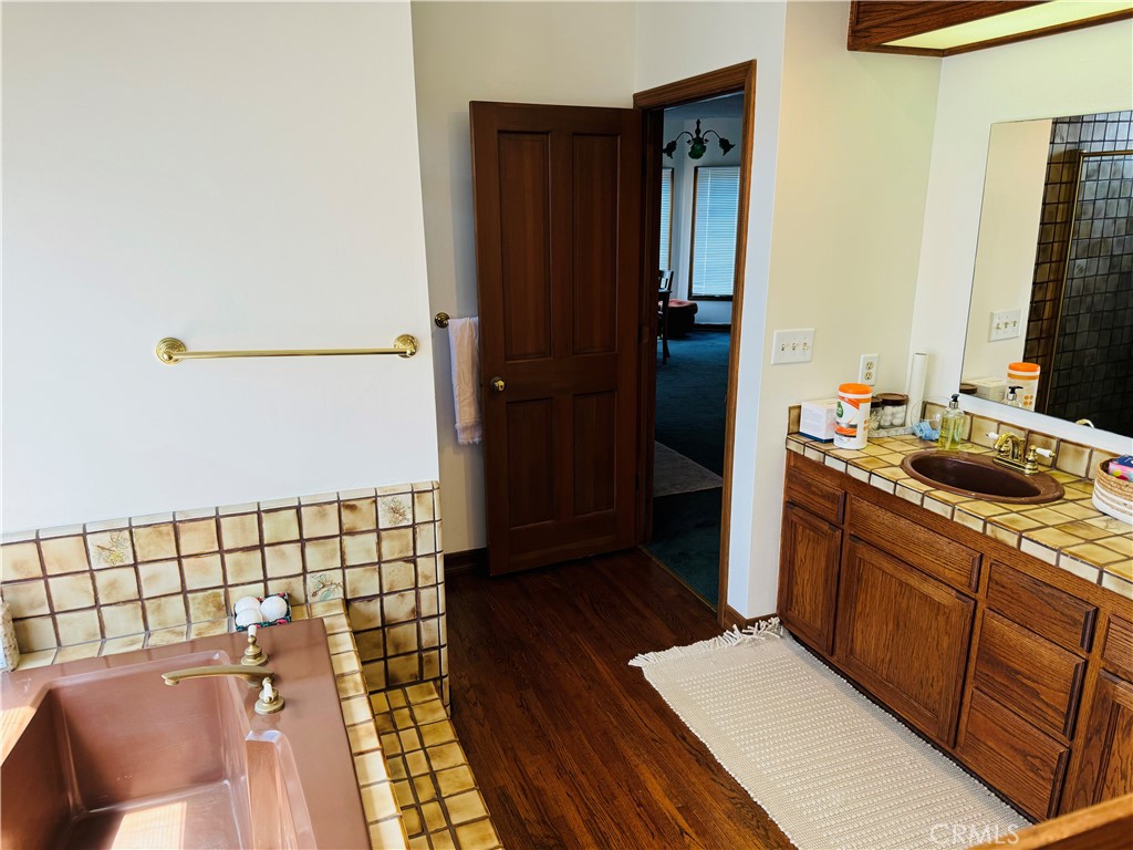 87 Rivo Alto Canal Long Beach, CA 90803 - Photo 28 of 34 a bathroom with a sink and a mirror