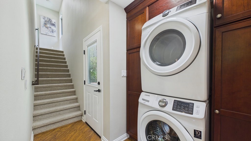 340 Toyon Road Sierra Madre, CA 91024 - Photo 23 of 60 Laundry area featuring a side door access to the pool area and stairs leading to the upstairs bedroom with en-suite bath.