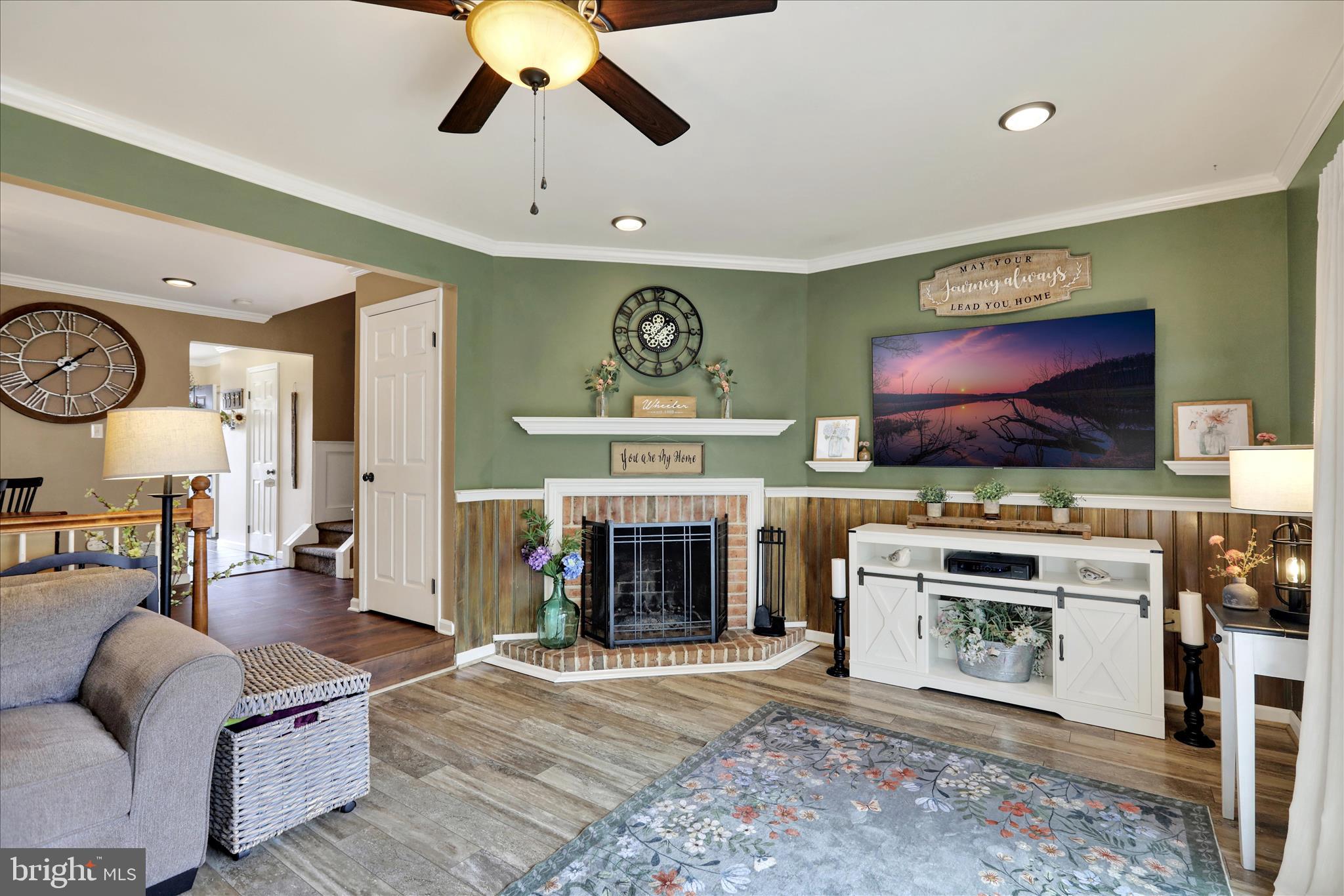 59 Winchester Court Reading, PA 19606 - Photo 12 of 39 a living room with furniture flat screen tv and a fireplace
