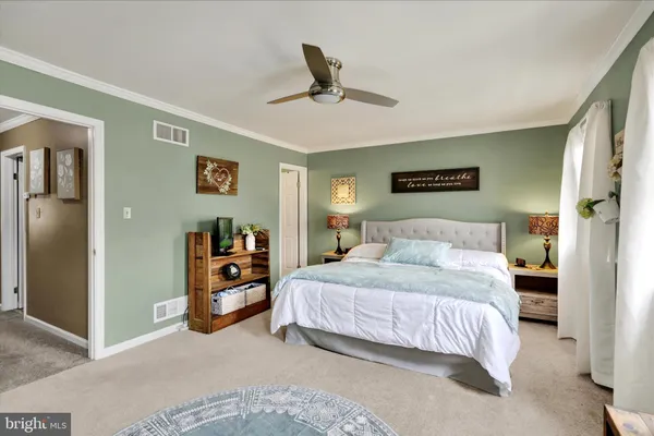a bedroom with furniture and window