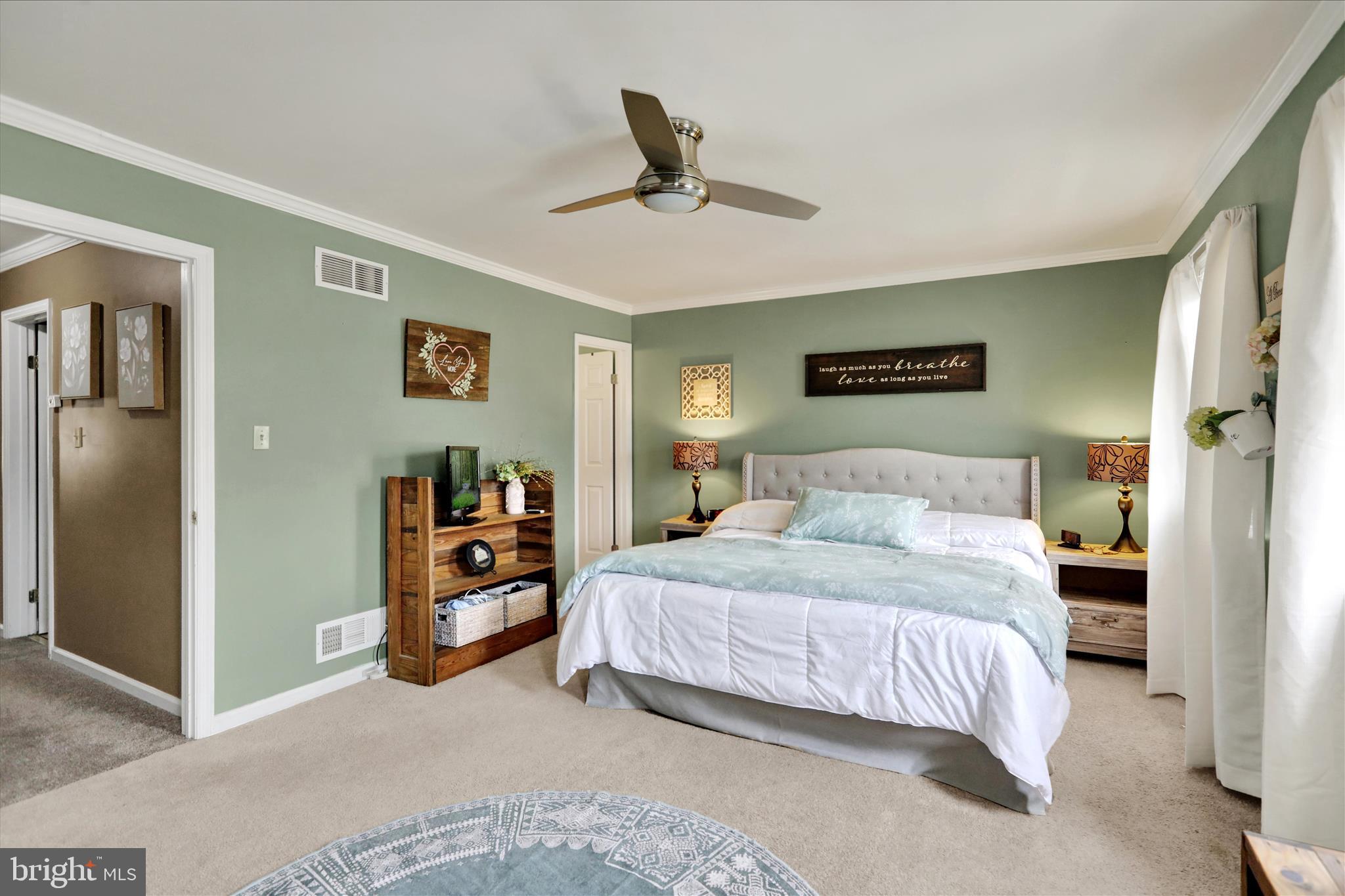 59 Winchester Court Reading, PA 19606 - Photo 15 of 39 a bedroom with a bed and a chandelier