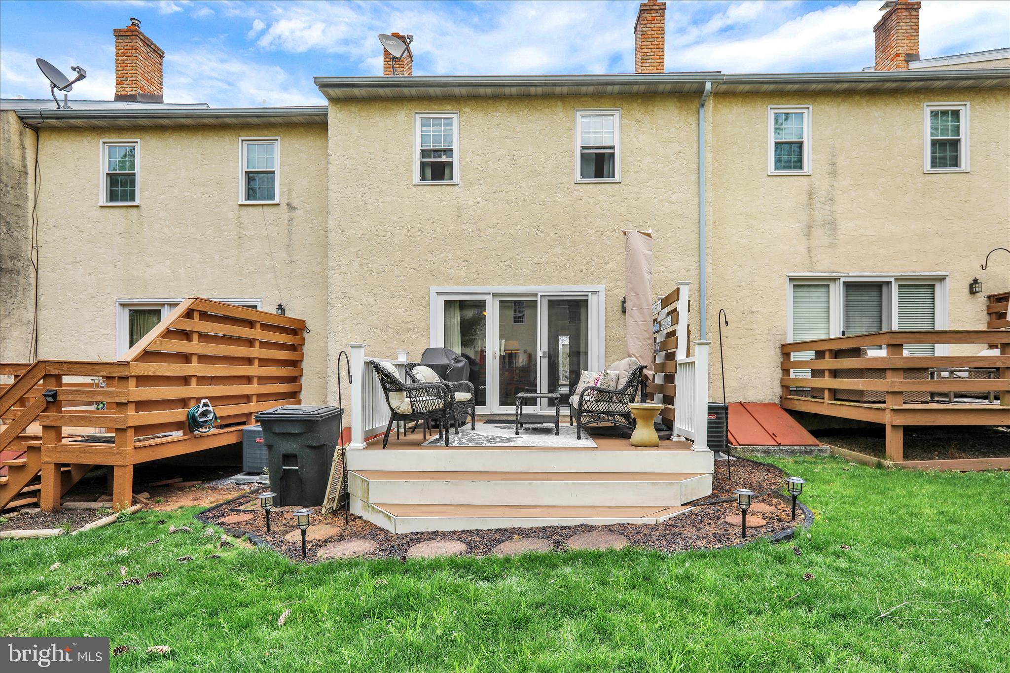 59 Winchester Court Reading, PA 19606 - Photo 31 of 39 a view of a house with a backyard and a patio