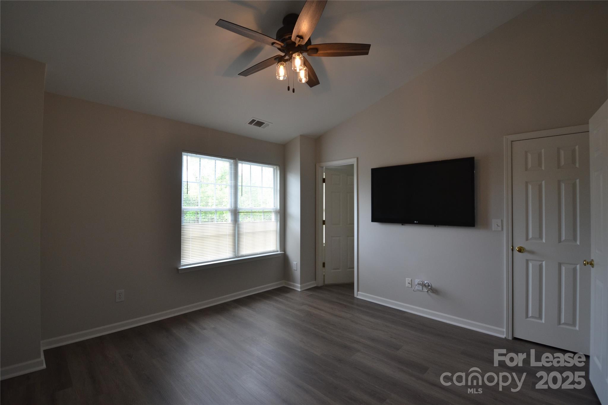 9647 Bailey Road Cornelius, NC 28031 - Photo 14 of 29 a view of a livingroom with a flat screen tv