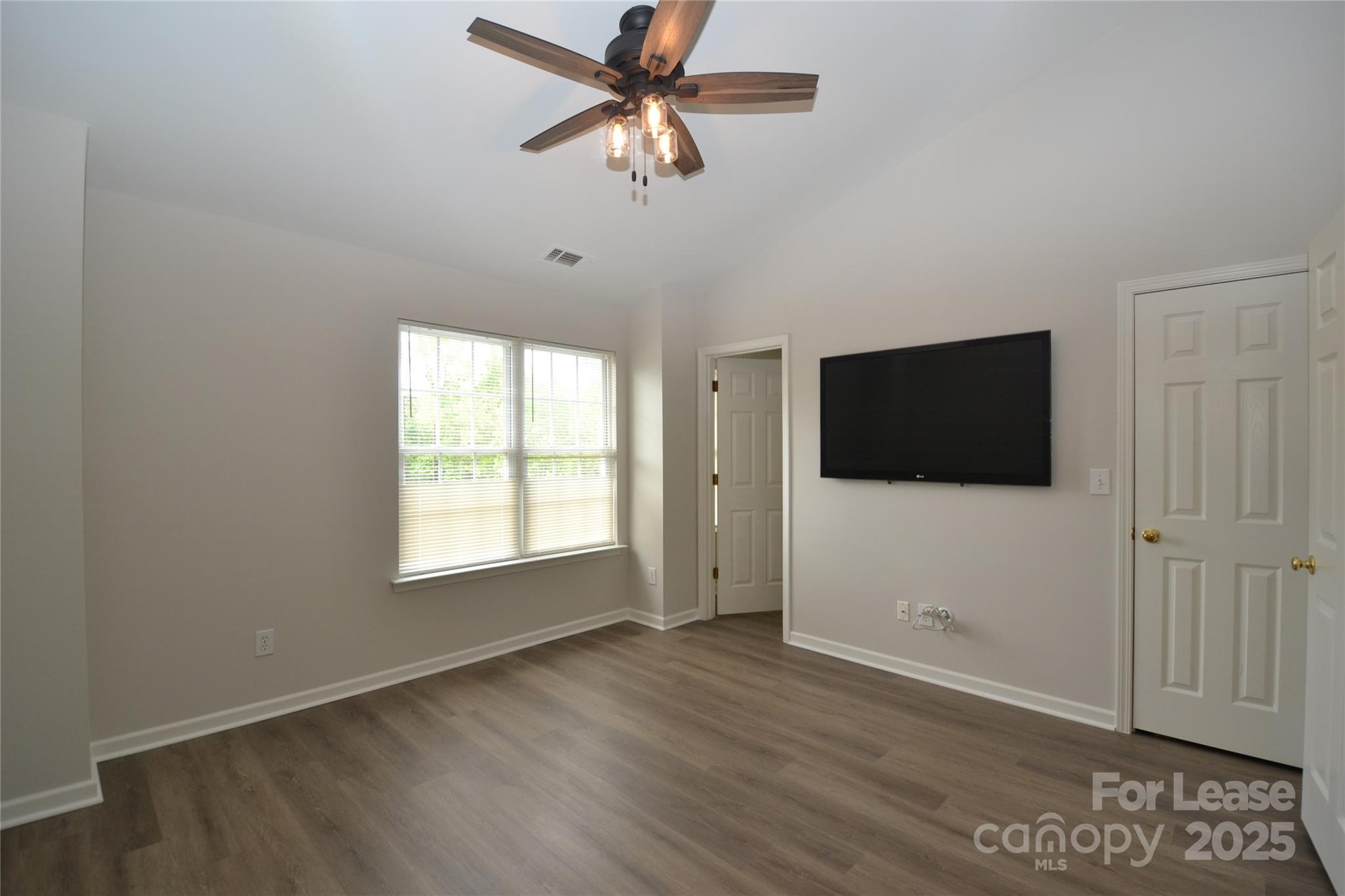 9647 Bailey Road Cornelius, NC 28031 - Photo 15 of 29 a view of a livingroom with a flat screen tv
