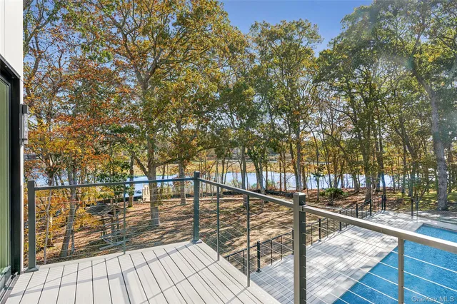 a view of an empty room and wooden floor