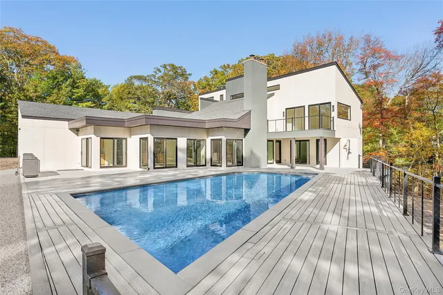 a view of staircase with white walls and a window