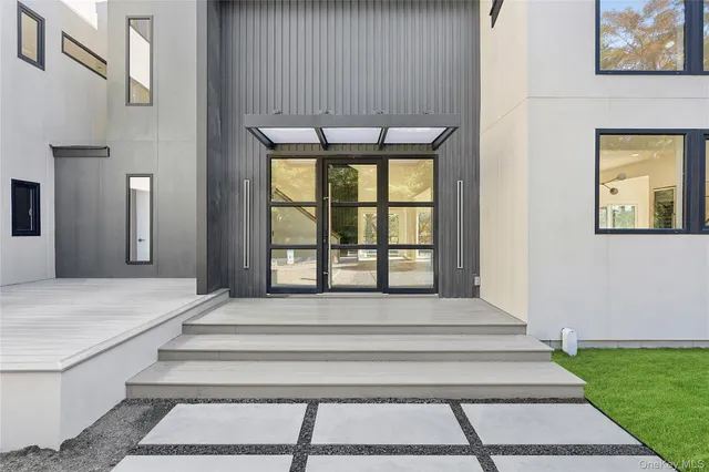 a large kitchen with stainless steel appliances granite countertop a stove and a sink