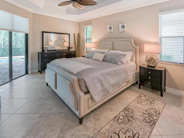 a bed room with a bed and a television