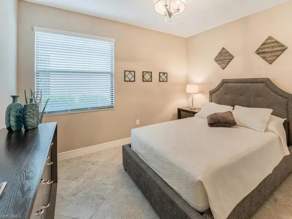 a large white bed in a white room