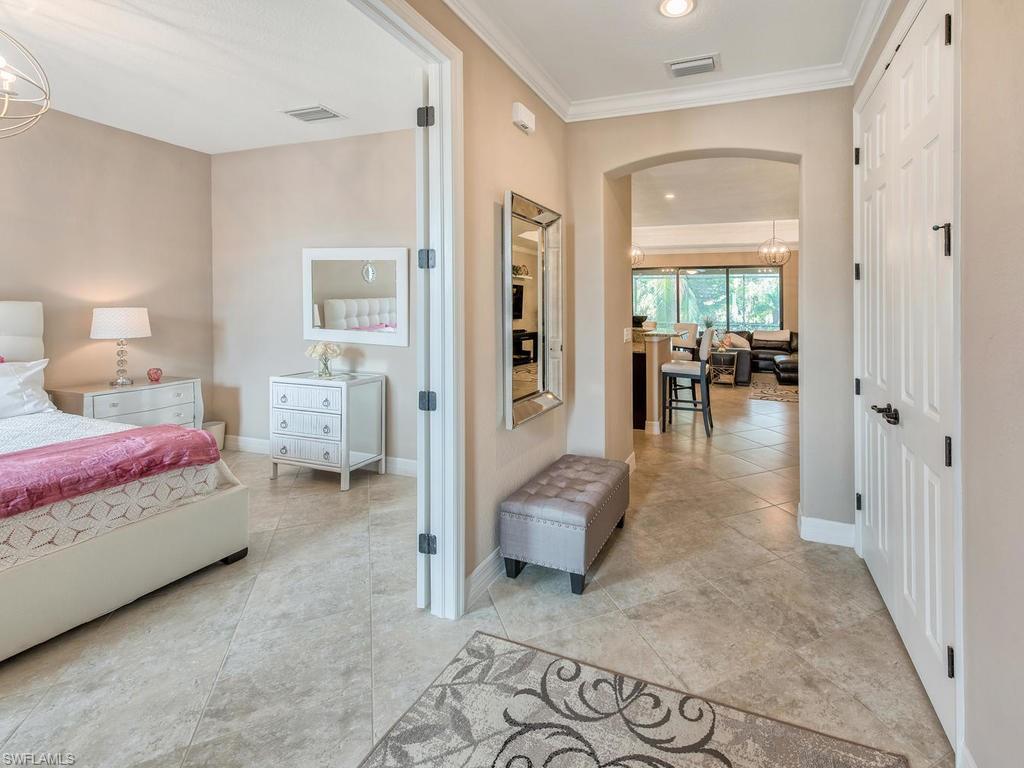 9491 Piacere Way Naples, FL 34113 - Photo 4 of 34 a living room with furniture and dining area