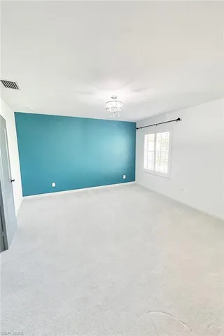 a spacious bathroom with a double vanity sink a mirror and a bathtub