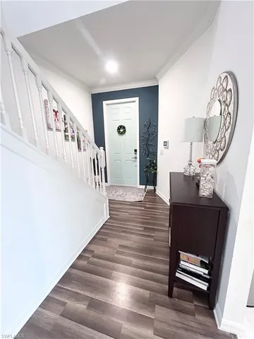 a living room with furniture window and a wooden floor