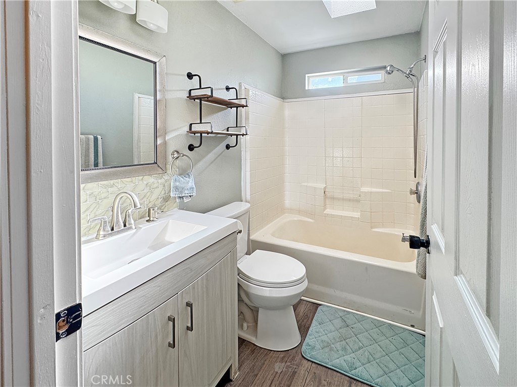 220 South Elk, Unit 75 Hemet, CA 92543 - Photo 12 of 14 a bathroom with a sink toilet and shower