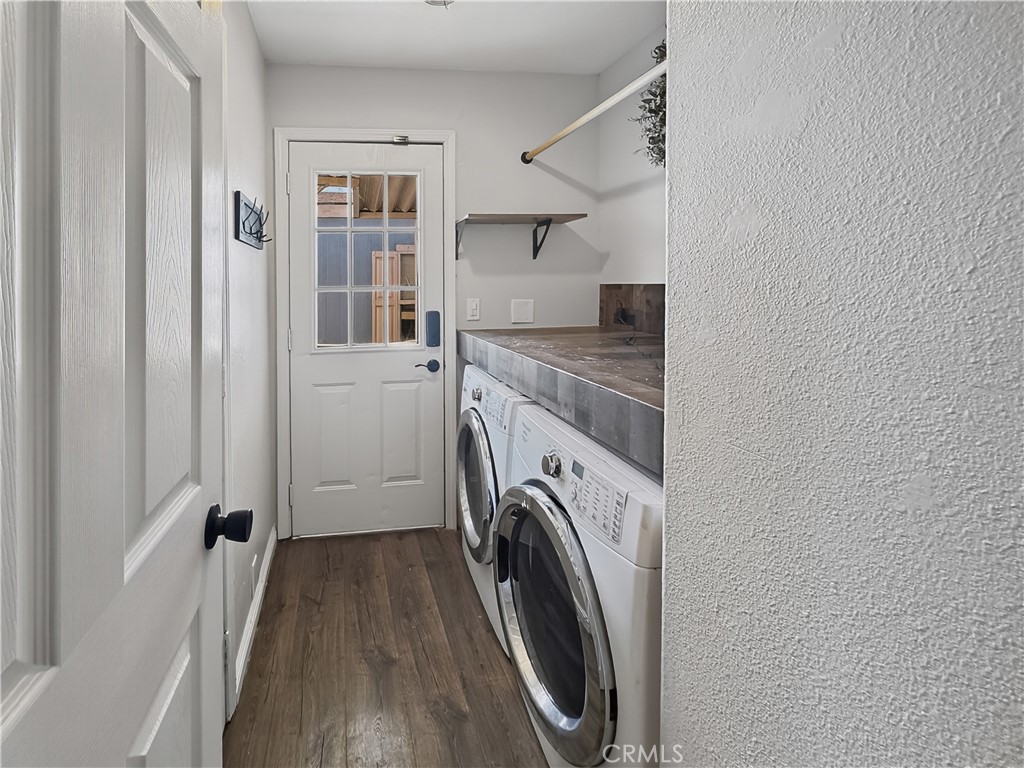 220 South Elk, Unit 75 Hemet, CA 92543 - Photo 13 of 14 a view of a hallway with washer and dryer