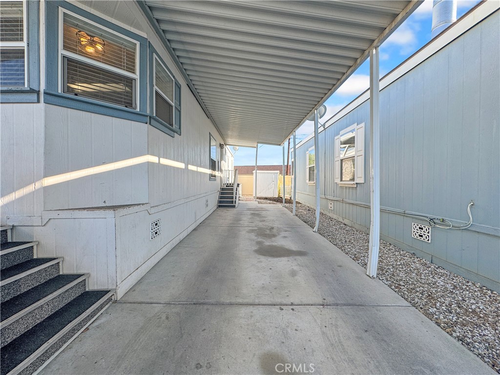 220 South Elk, Unit 75 Hemet, CA 92543 - Photo 3 of 14 a view of a porch with wooden floor