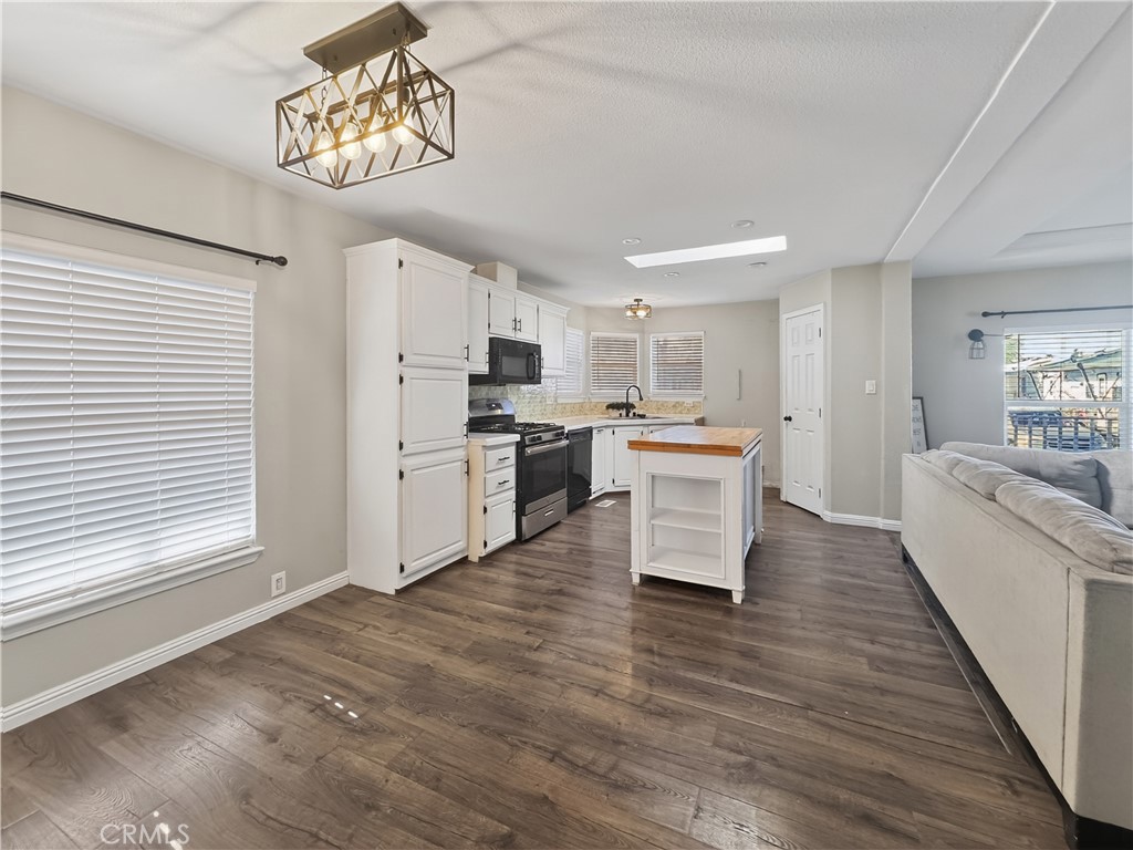 220 South Elk, Unit 75 Hemet, CA 92543 - Photo 6 of 14 a view of kitchen with cabinets and wooden floor