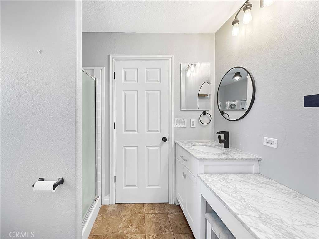 220 South Elk, Unit 75 Hemet, CA 92543 - Photo 9 of 14 a bathroom with a granite countertop double vanity sink and a mirror