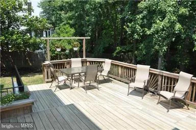 a view of balcony with deck and outdoor seating