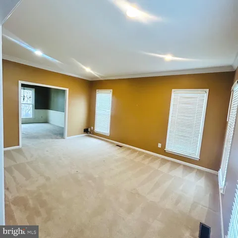 a view of an empty room with a fireplace