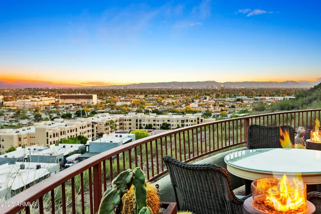 an aerial view of residential houses with city view