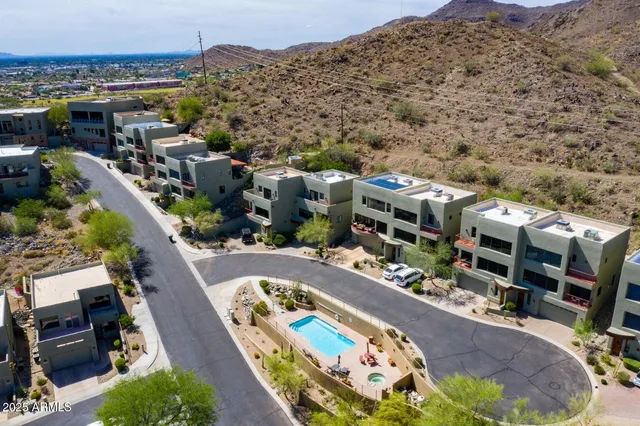a view of a swimming pool with seating area