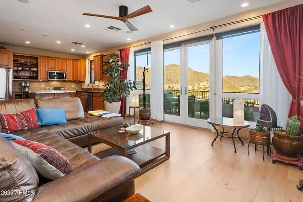 a living room with furniture and a large window