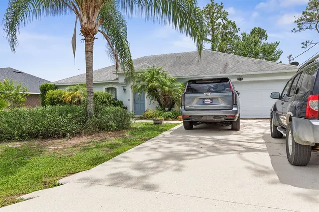 a parked cars parked in front of a house