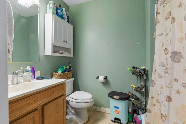 a bedroom with furniture and a flat screen tv