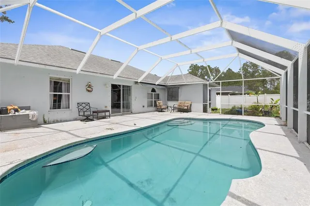 a view of a swimming pool with a garden