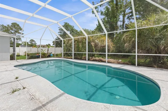 a view of a house with backyard and garden