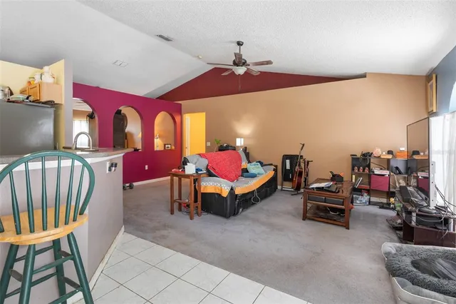 a bedroom with furniture and a chandelier
