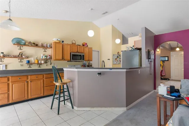 a kitchen with sink and cabinets