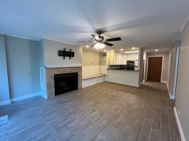 a view of a kitchen with a stove cabinets and wooden floor
