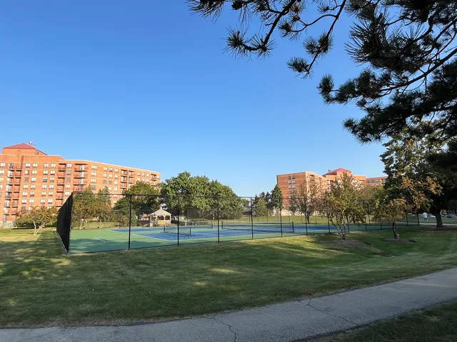a view of an outdoor space and tennis court