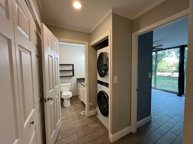 a view of a hallway with washer and dryer