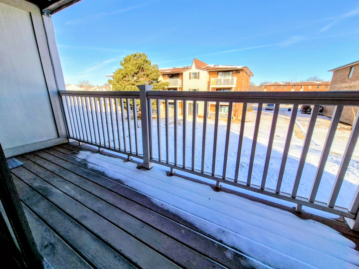 239 North Gregory Street, Unit 8 Aurora, IL 60504 - Photo 13 of 15 a view of balcony with wooden floor