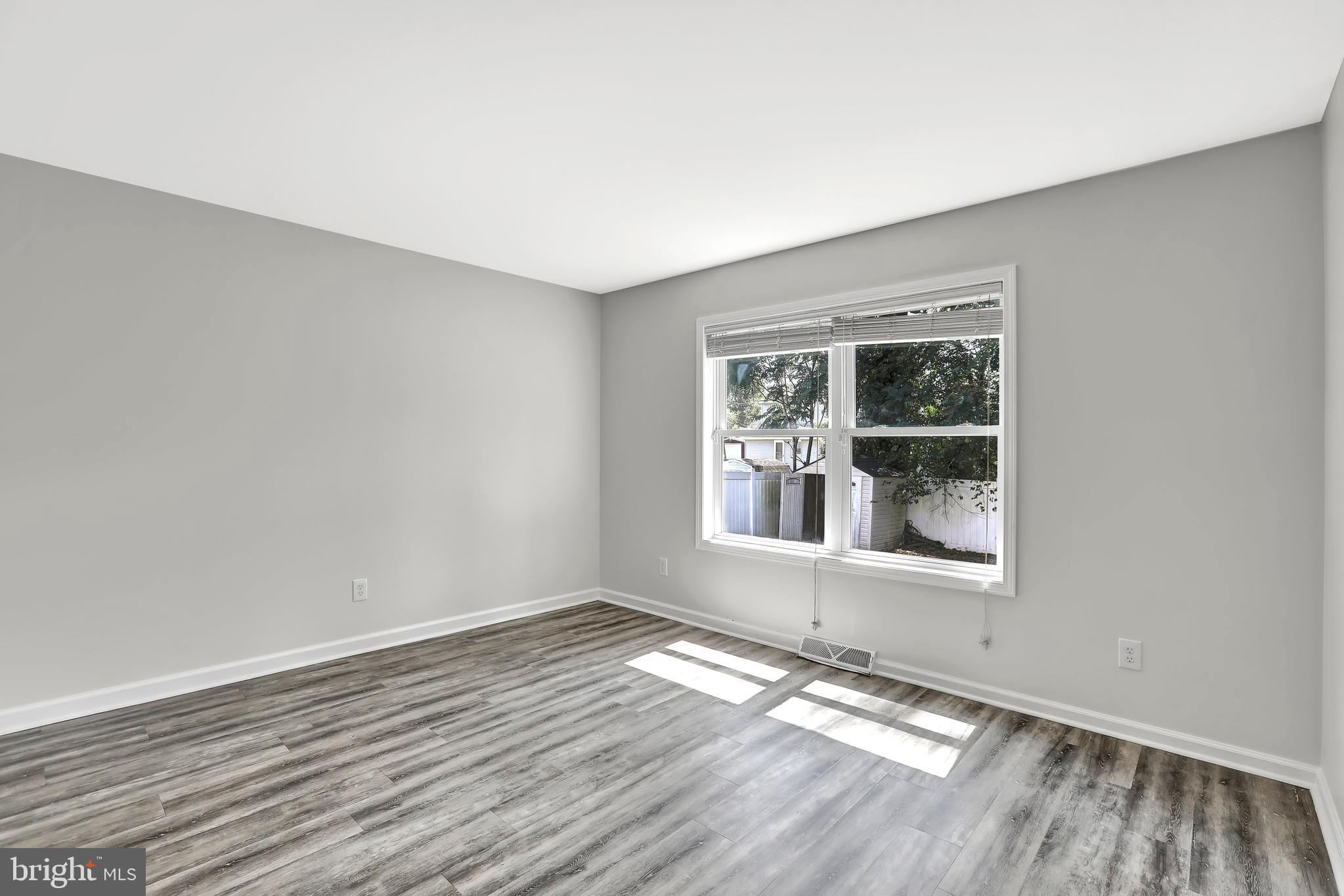 515 Ridge Avenue Hamilton, NJ 08610 - Photo 14 of 30 a view of empty room with wooden floor and fan